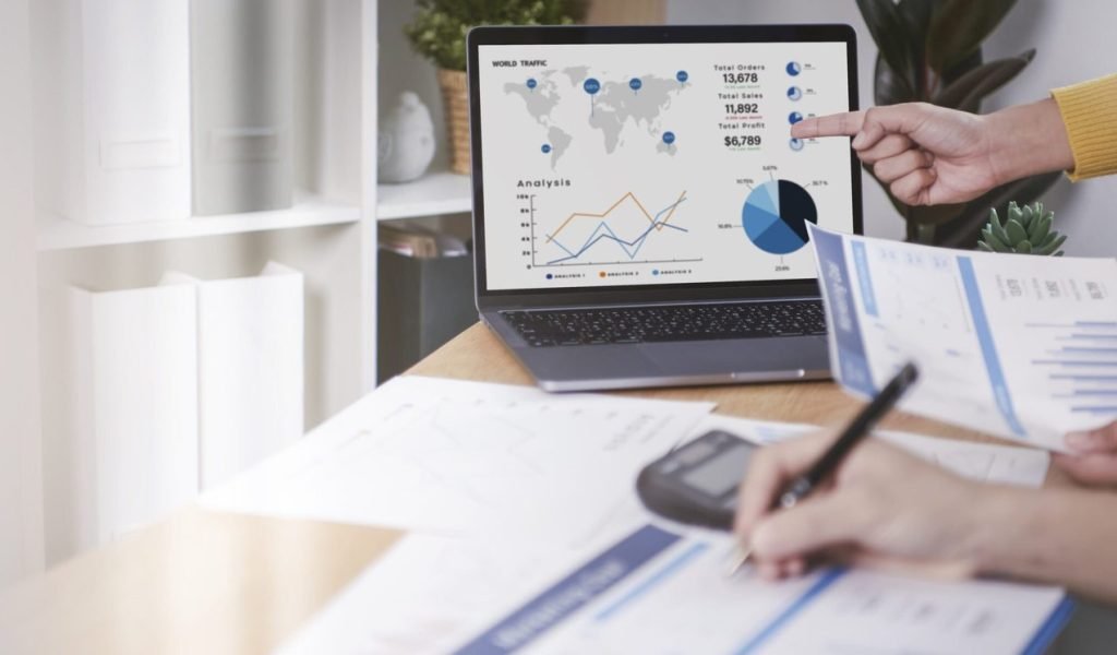 businesspeople-meeting-plan-analysis-graph-company-finance-strat-scaled